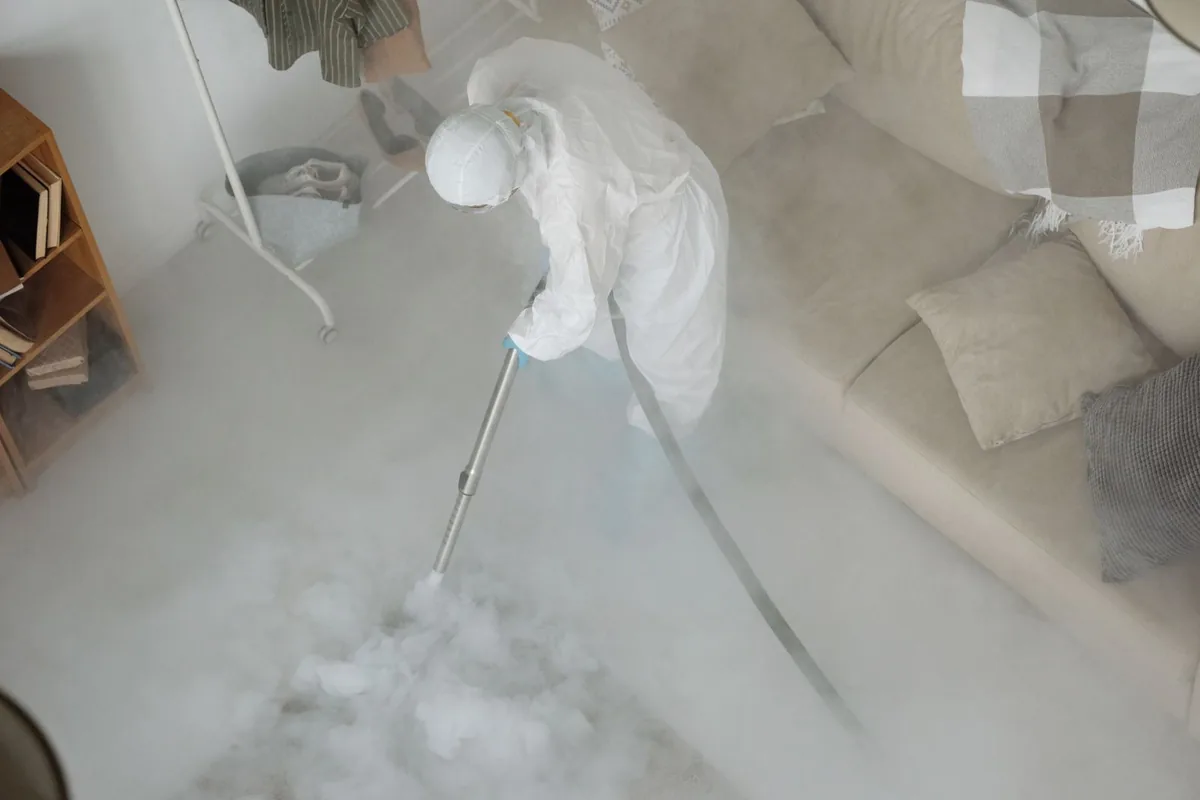 Biohazard cleanup technician in protective equipment, Cedaredge, CO